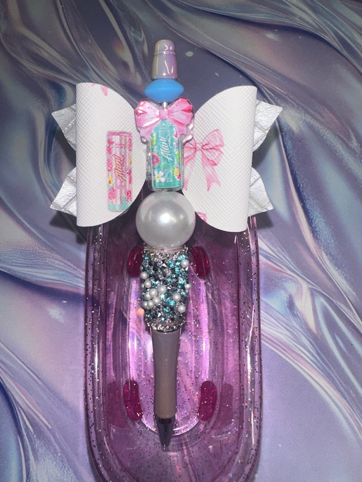 Alani Nu teal bow pen