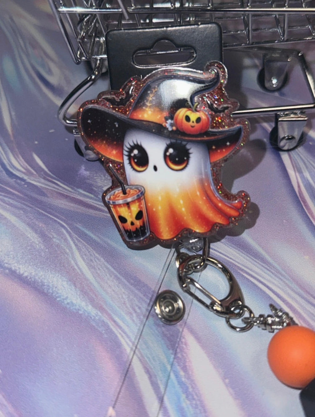 Witchy ghost badge reel angled view