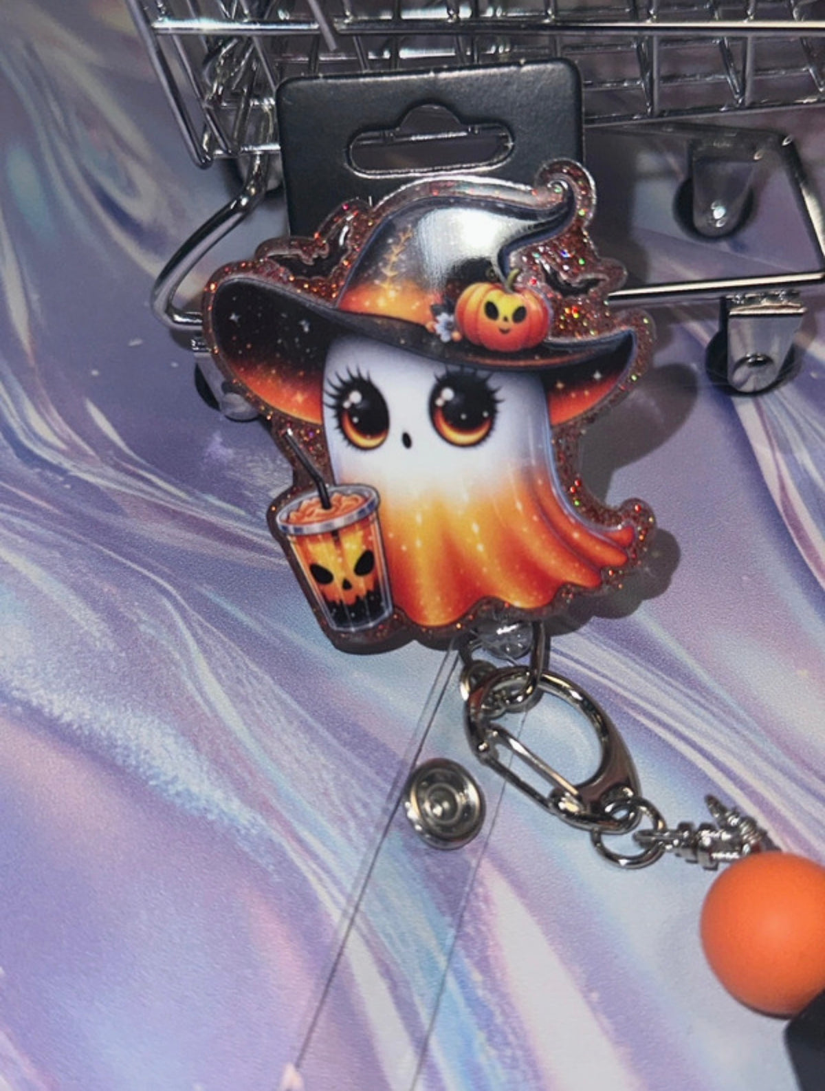 Witchy ghost badge reel angled view